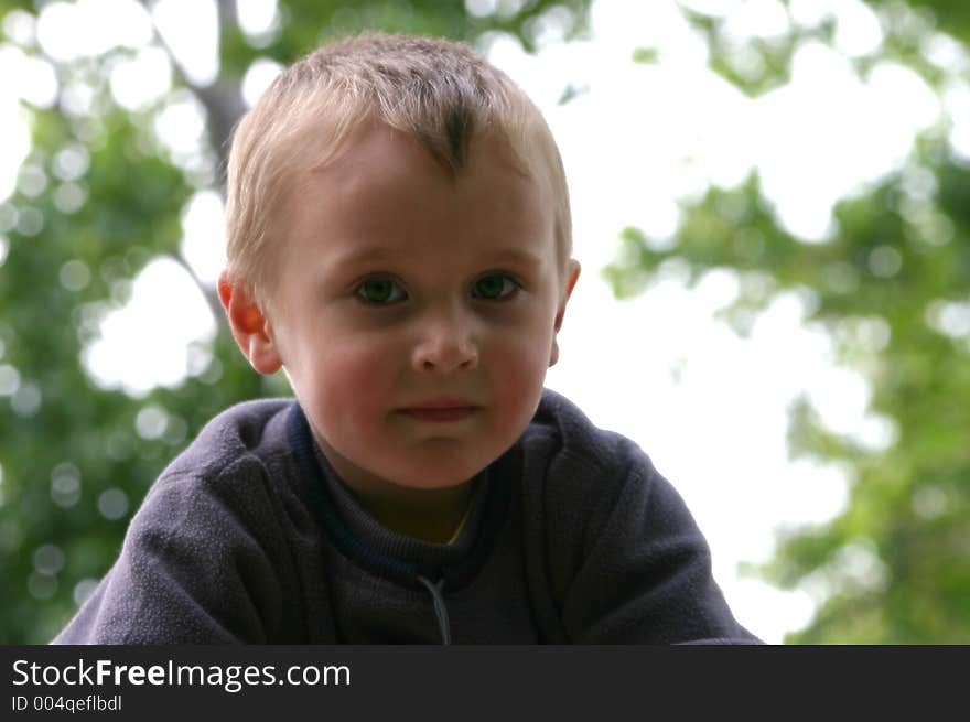 Cute Blonde children close-up portrait backlighted. Cute Blonde children close-up portrait backlighted