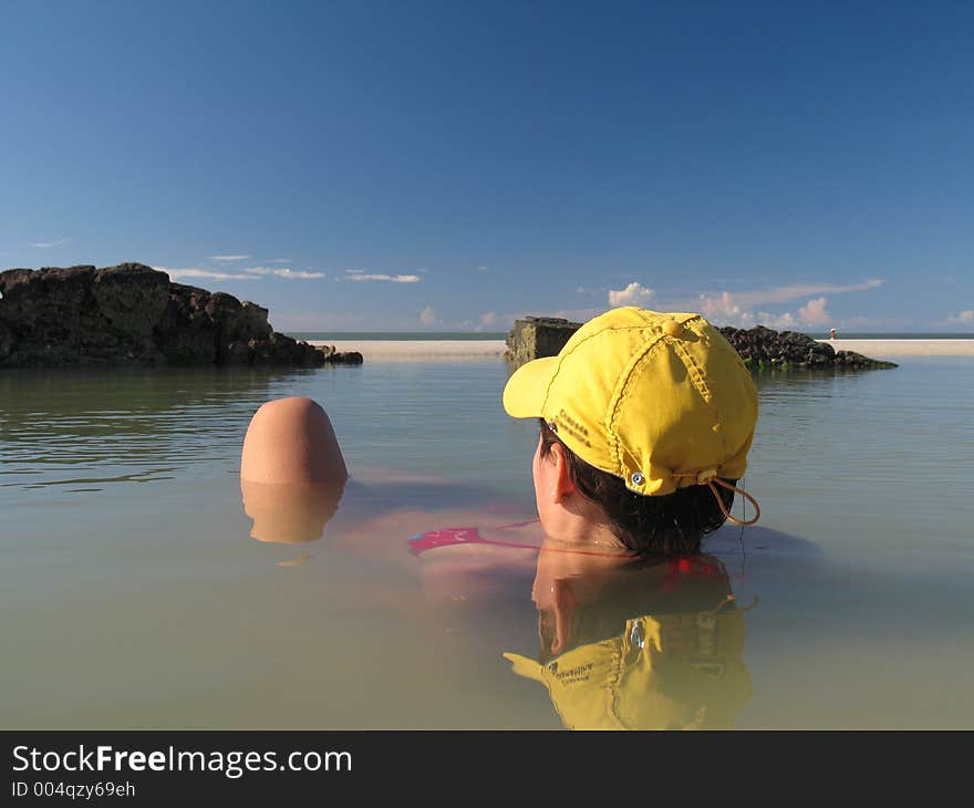 Immersed girl in the lagoon of the beach. Immersed girl in the lagoon of the beach