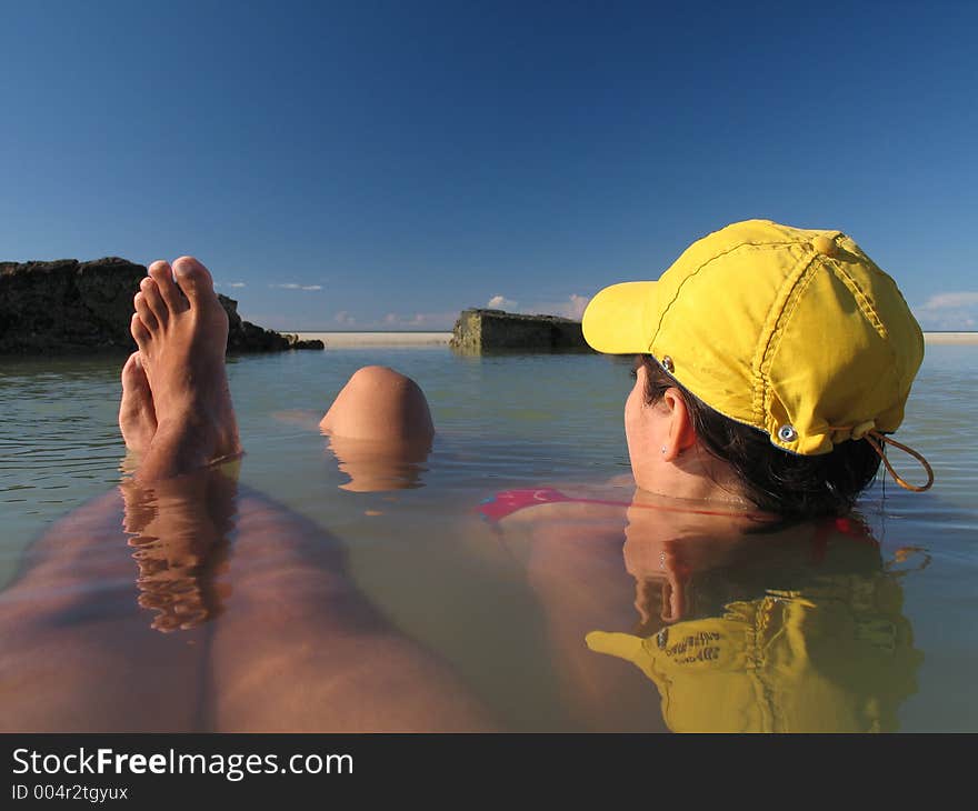 Immersed couple in the lagoon of the beach. Immersed couple in the lagoon of the beach