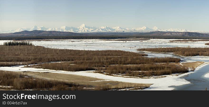 Mt. Hess and the rest ot the north-east part pf the Alaska range in a nice morning spring panoramic image. The image is a composite of 9 stitched images, cropped and downsampled. Soft morning light, noises of the river breaking up, song of birds - what could have been better?. Mt. Hess and the rest ot the north-east part pf the Alaska range in a nice morning spring panoramic image. The image is a composite of 9 stitched images, cropped and downsampled. Soft morning light, noises of the river breaking up, song of birds - what could have been better?