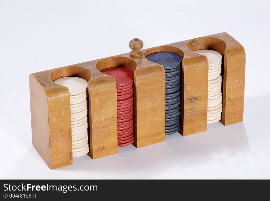 A case filled with antique wooden poker chips. A case filled with antique wooden poker chips