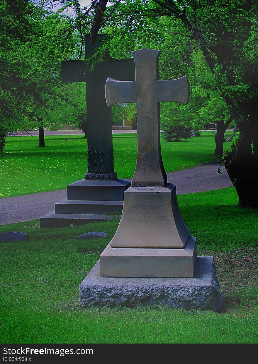 Two large crosses in a cemetery, with fog