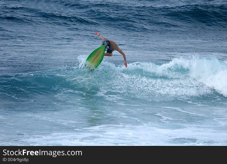 Surfer hitting the lip. Surfer hitting the lip.