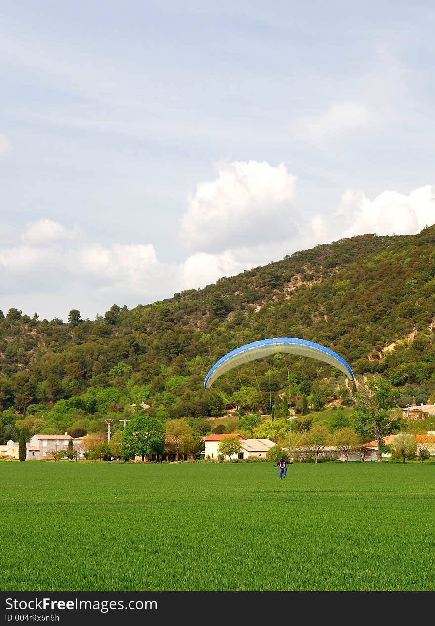 Almost touchdown for this French parasailor (pilot). Somewhere in the south of France. Almost touchdown for this French parasailor (pilot). Somewhere in the south of France.