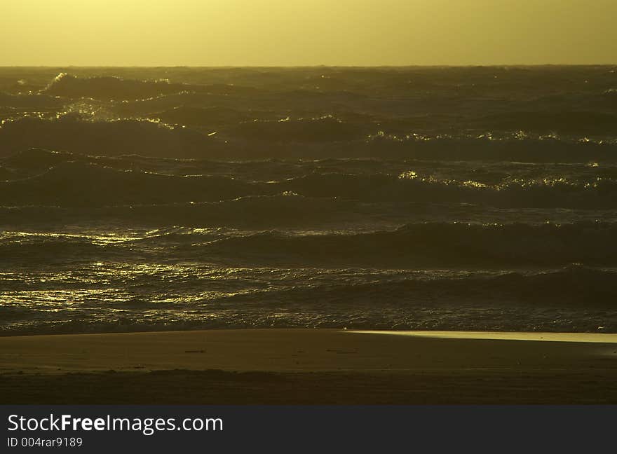 A rough sea in the light of the sunset. A rough sea in the light of the sunset