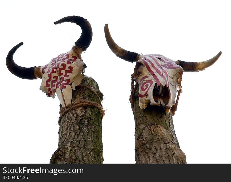 Two rural skulls on a pole