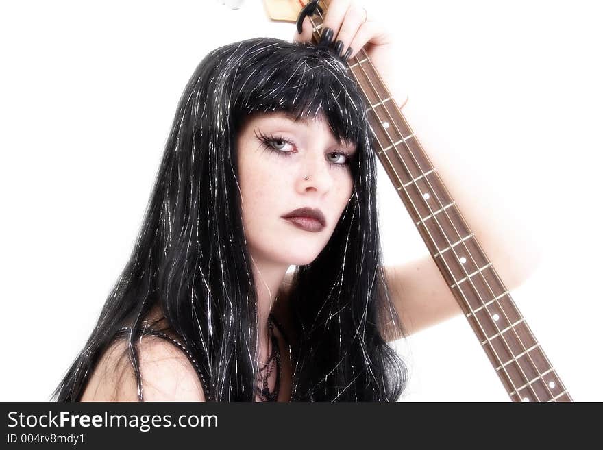 Teen girl bass player in goth fashion. Teen girl bass player in goth fashion.