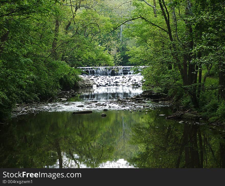 Waterfall in the woods, afar. Waterfall in the woods, afar