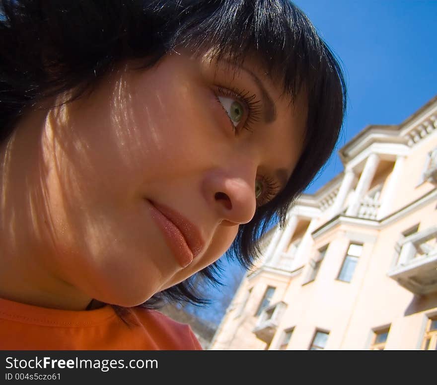 The girl on a background of a building