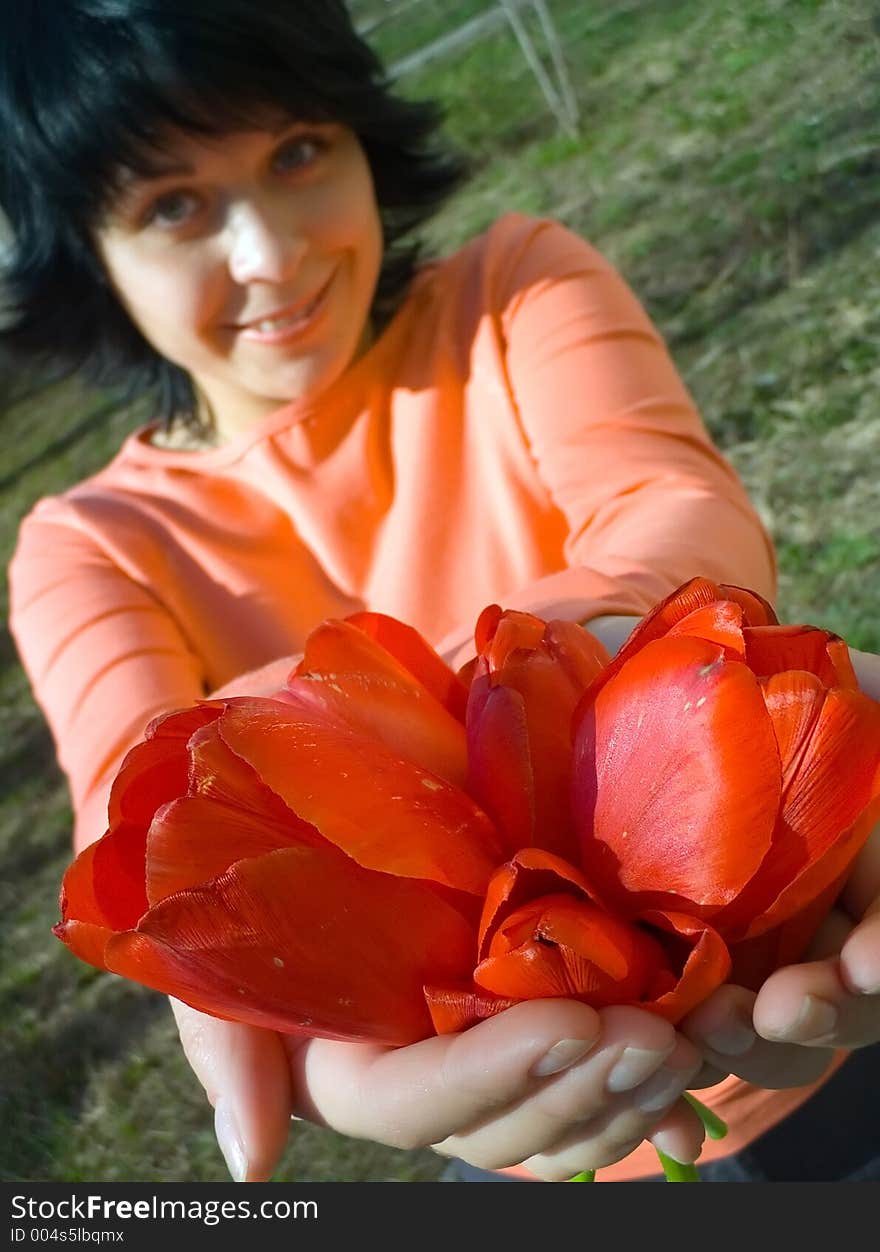 The girl gives flowers. The girl gives flowers