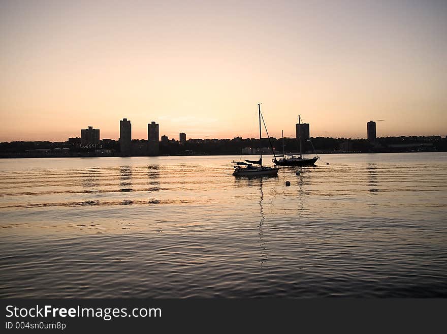 Quiet evening on Hudson river, New Jersey skyline. Quiet evening on Hudson river, New Jersey skyline.