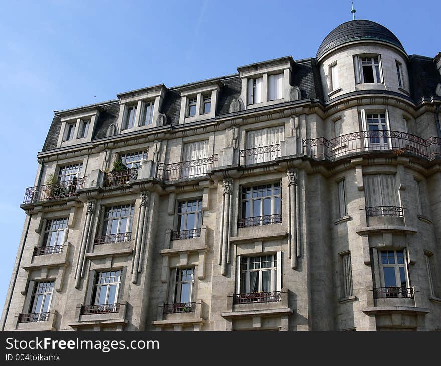 House facade in France in front of blue sky