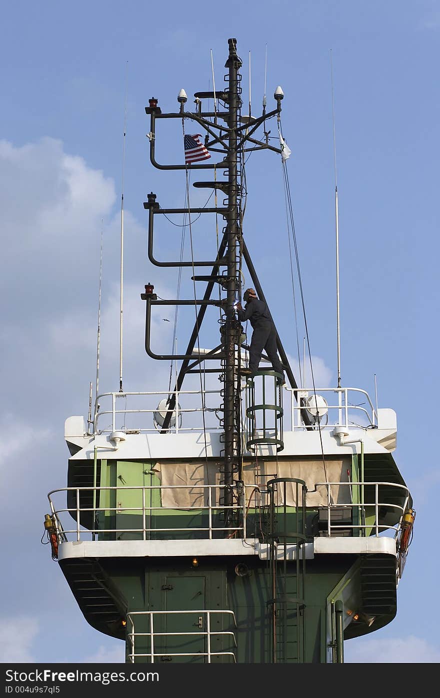 Welder on top of tug working. Welder on top of tug working