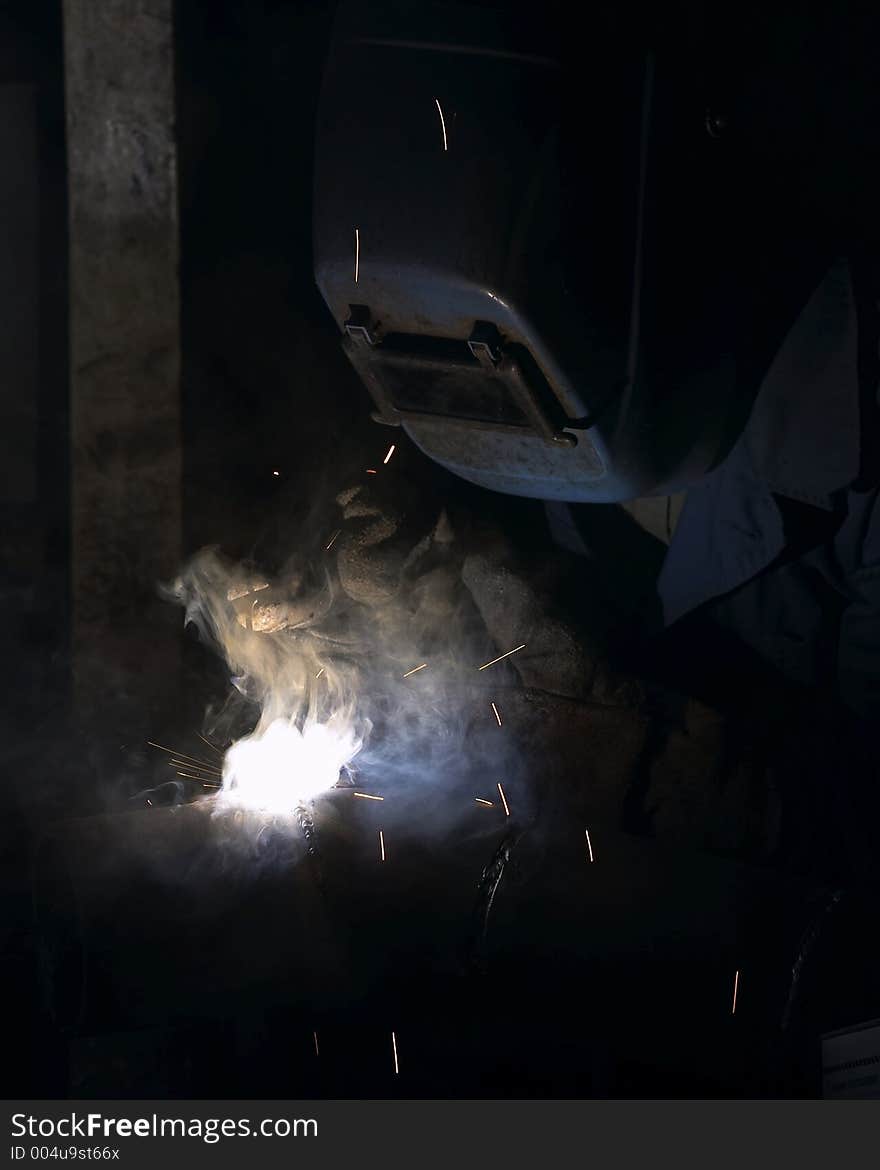 Welder working in smoke