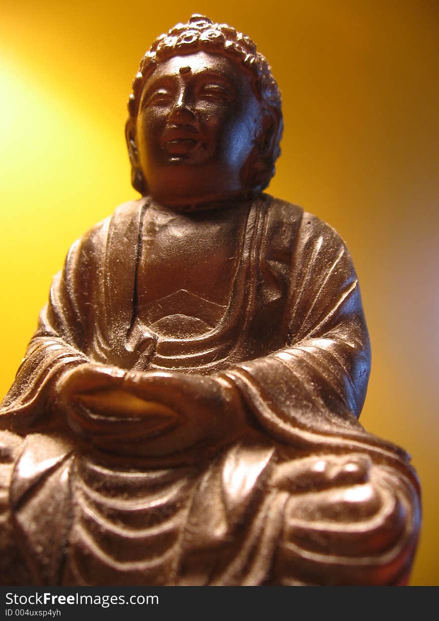 This image depicts a smiling Buddha. This image depicts a smiling Buddha.