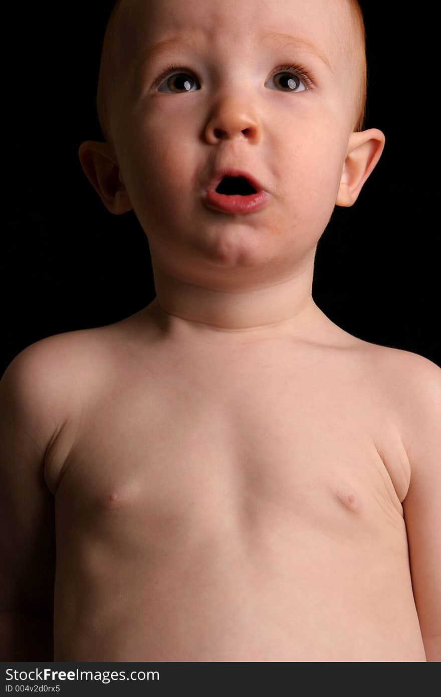 Redhead toddler looking forward. Redhead toddler looking forward