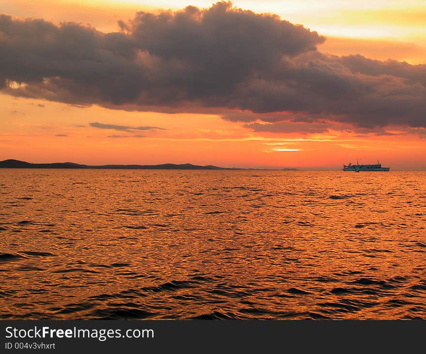 Amazing burning sky, with ship on a horizon. Amazing burning sky, with ship on a horizon