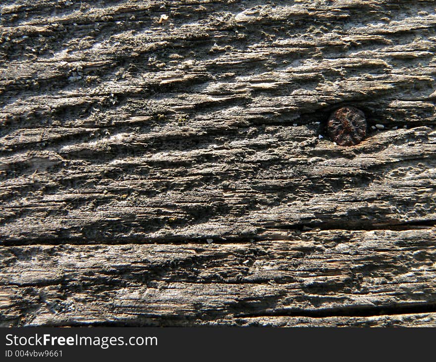 Aging board with nail. Aging board with nail