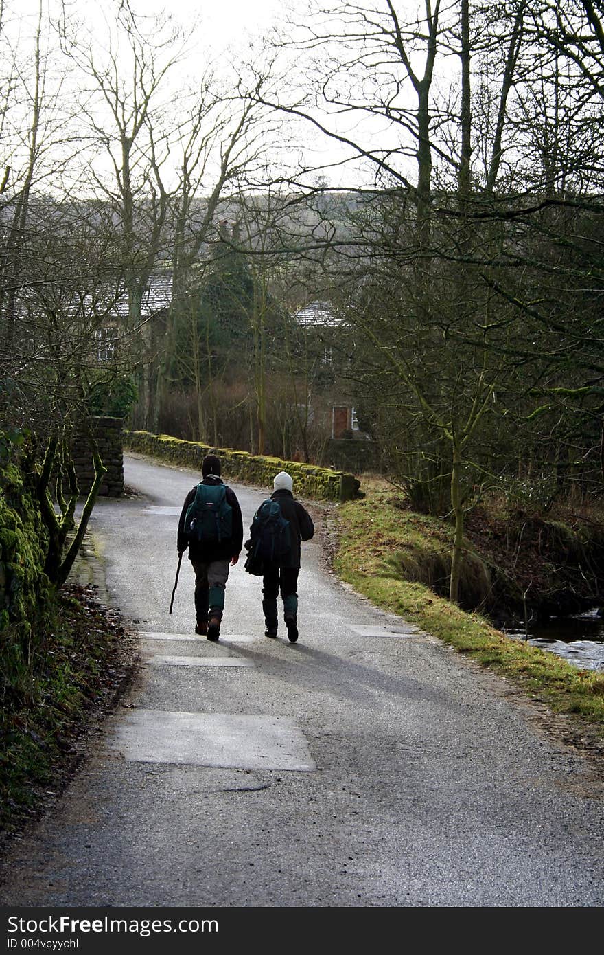 A couple out for a winters ramble in a wooded area. A couple out for a winters ramble in a wooded area.