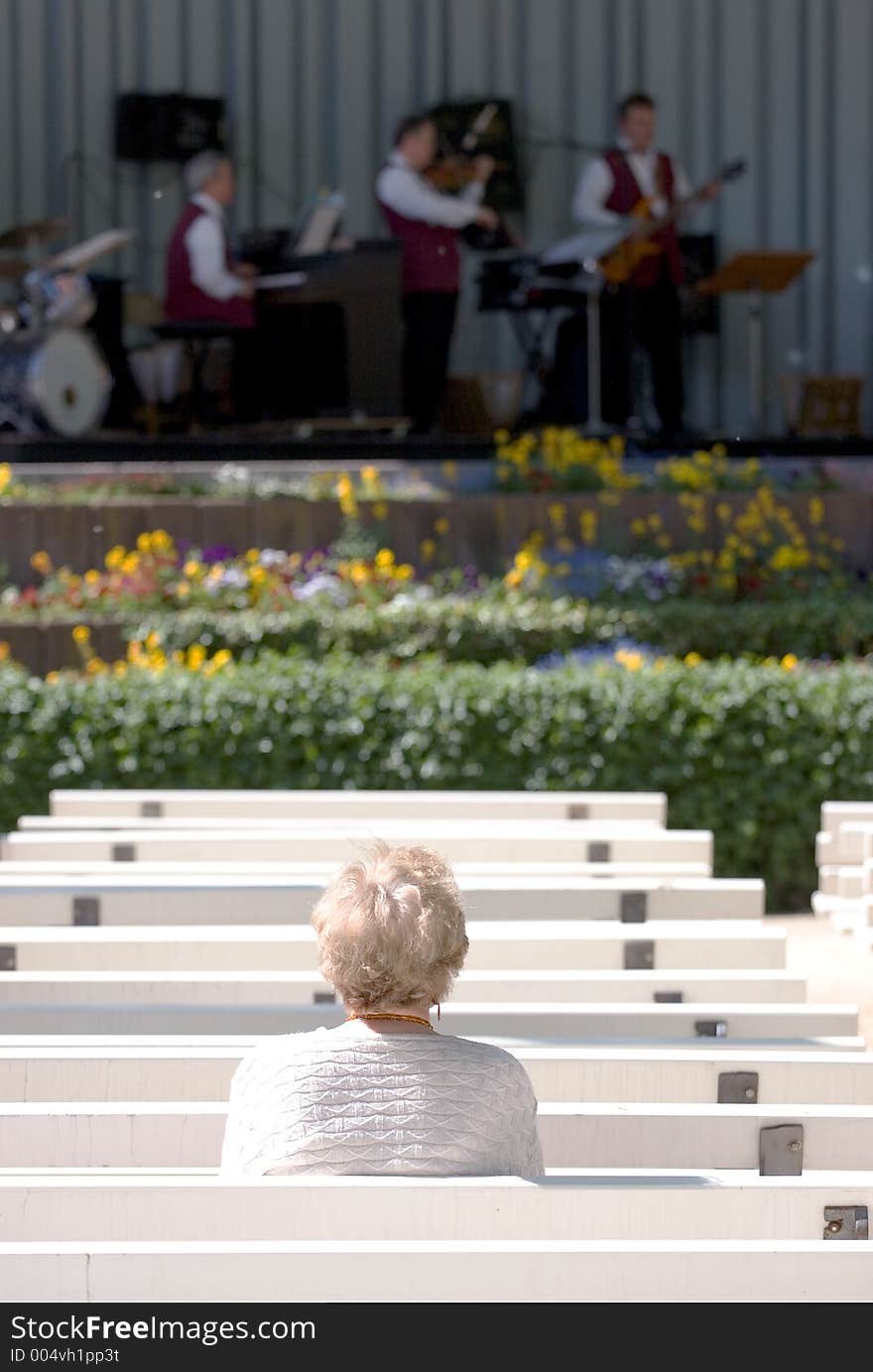 Lone elderly woman watching Jazz