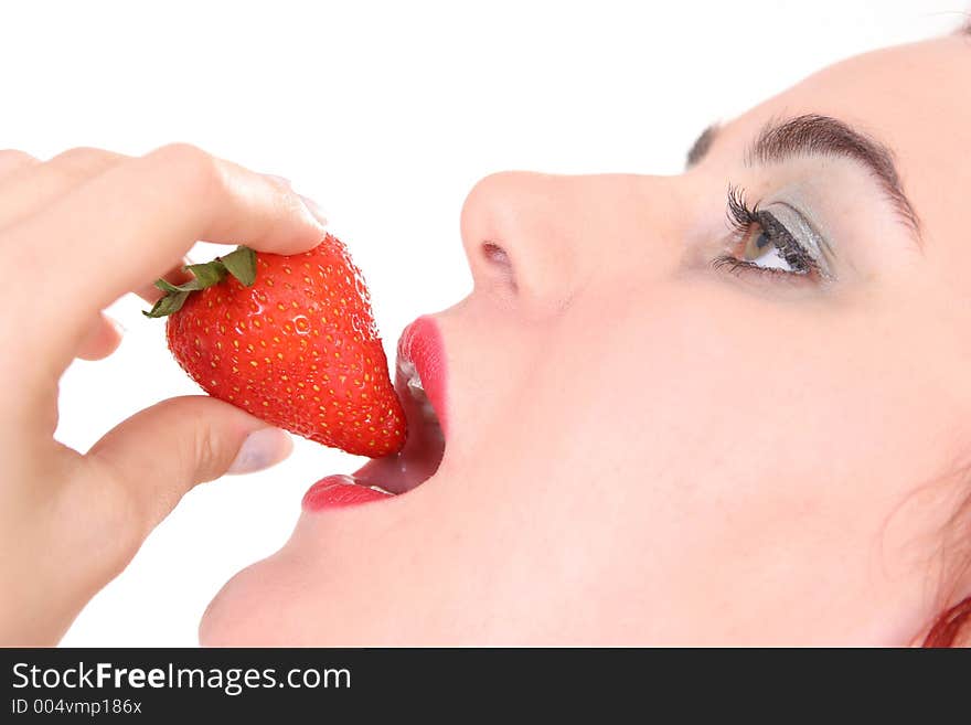 Girl eating strawberry. Girl eating strawberry