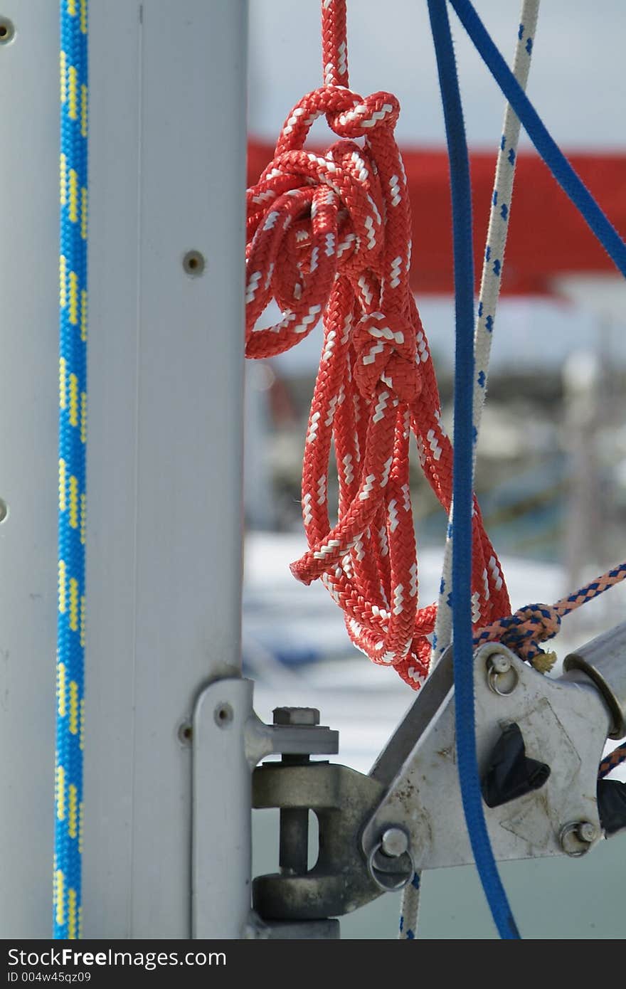 Red halyard hanging from the mast