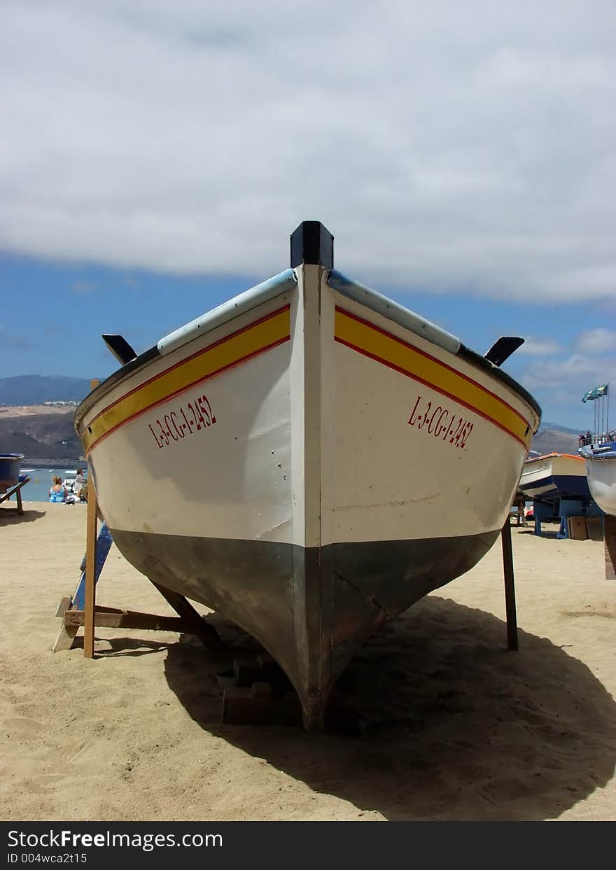 A boat over the sand. A boat over the sand.