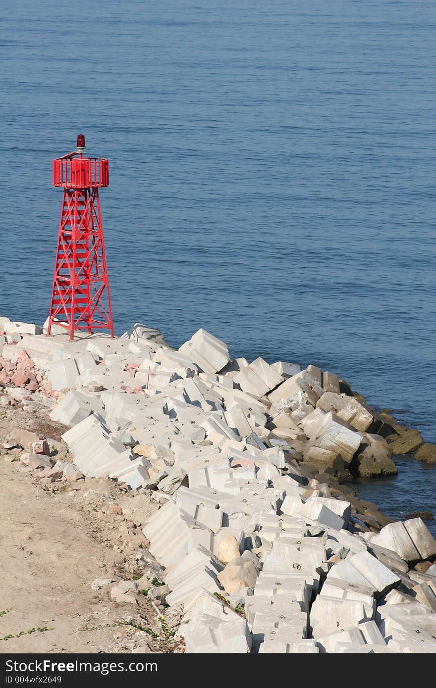 Red beacon light on coast