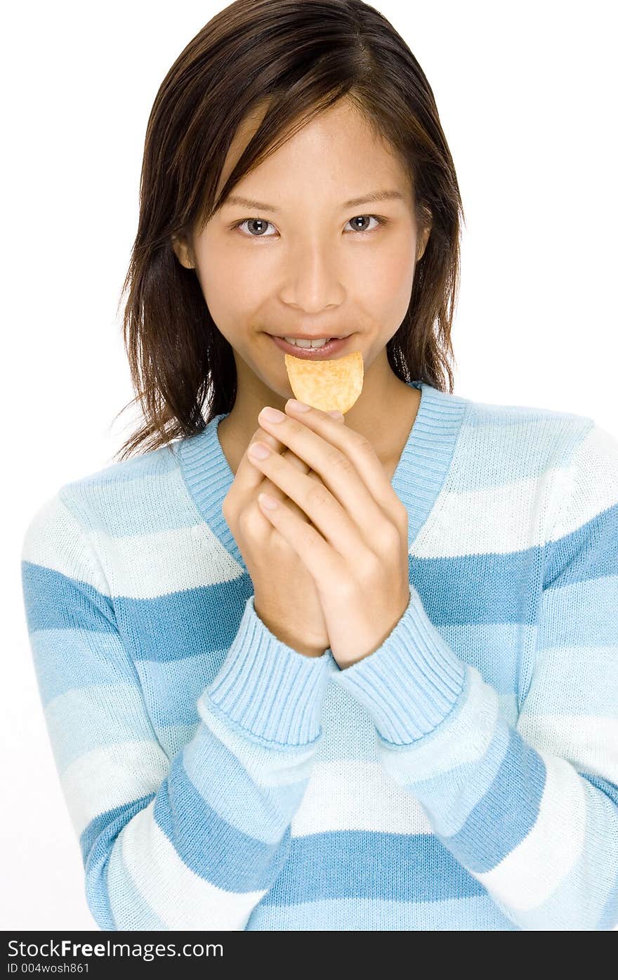 A pretty asian woman holding a chip. A pretty asian woman holding a chip