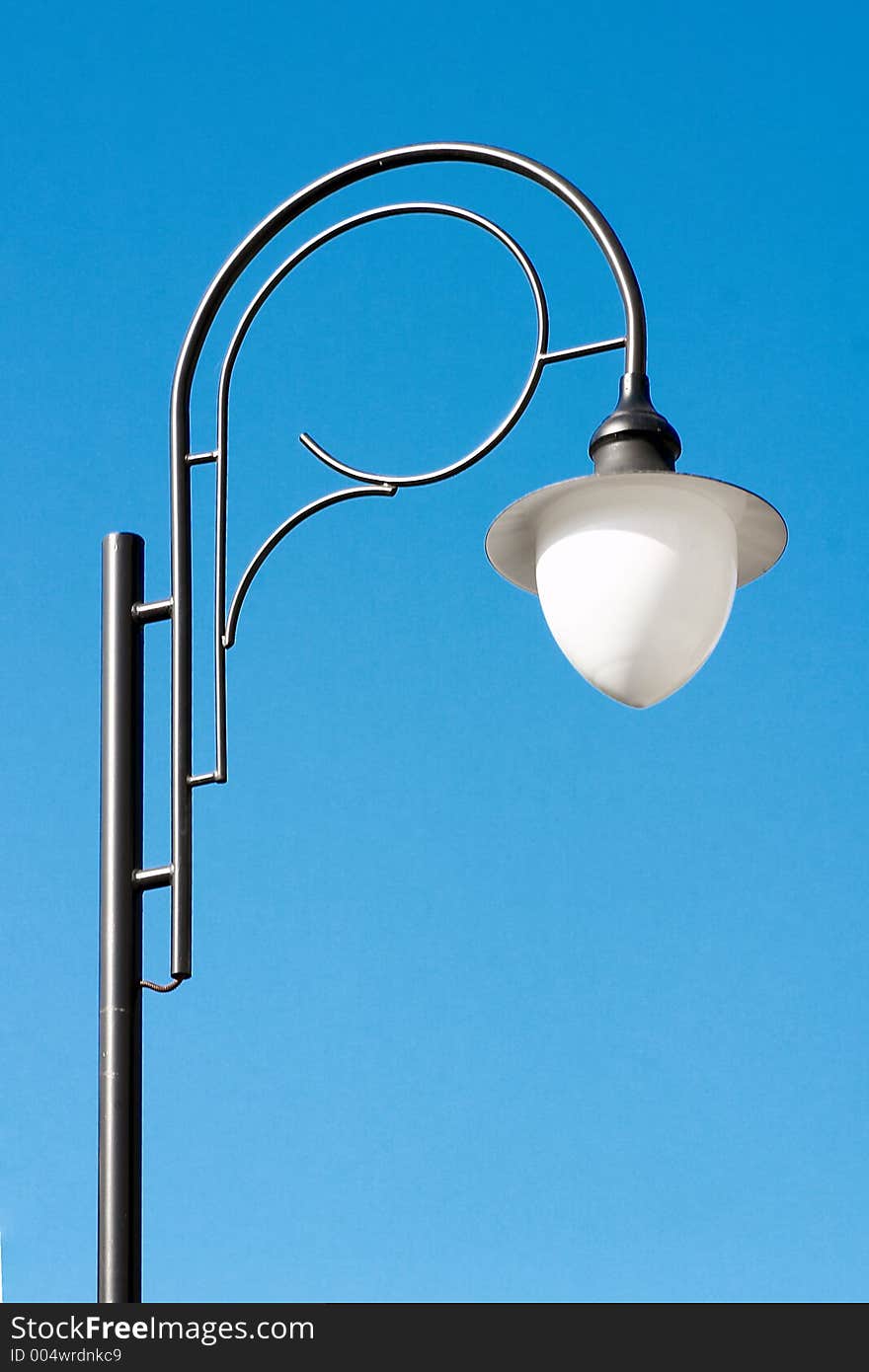 Lamp post on blue sky