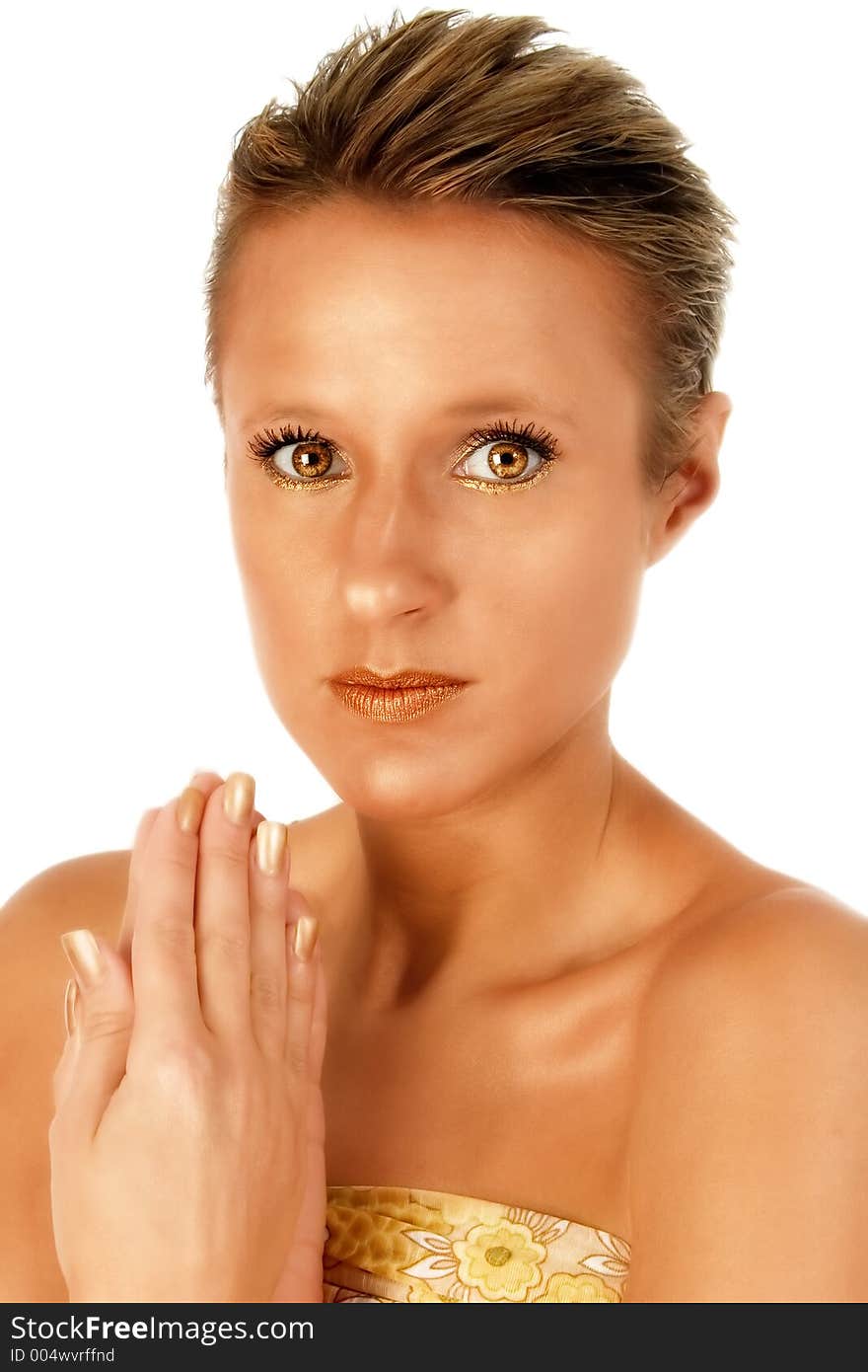 Beautiful woman in bronze face paint with bronze eye color. Beautiful woman in bronze face paint with bronze eye color.