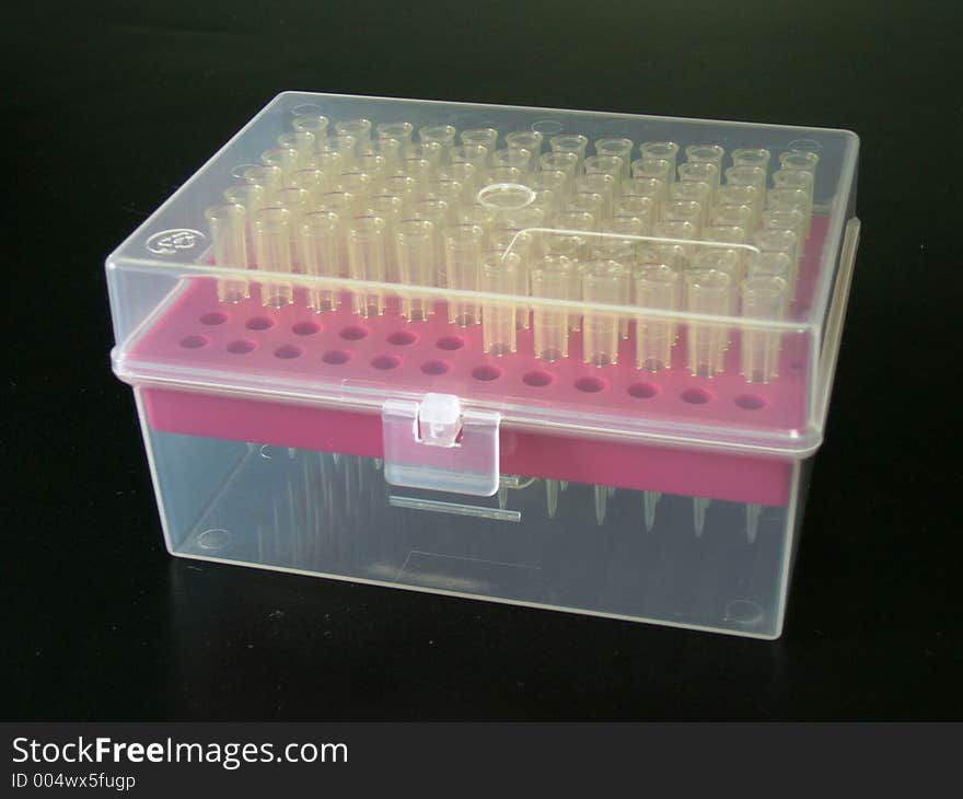 Laboratory tips in a half-transparent box. Laboratory tips in a half-transparent box