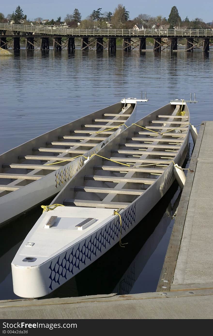 Two dragon boats docked on the gorge in Victoria, BC. Two dragon boats docked on the gorge in Victoria, BC.