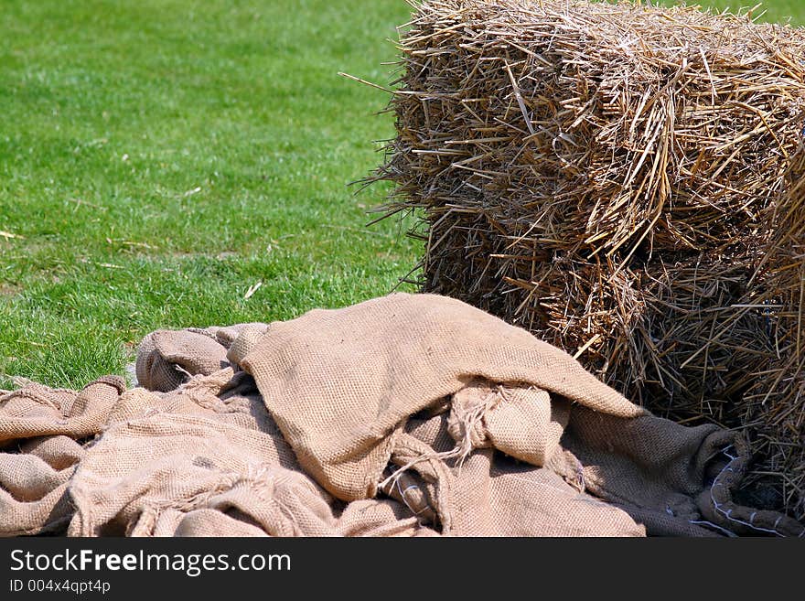 Hay stock and sack on the meadow on a sunny spring day. Hay stock and sack on the meadow on a sunny spring day