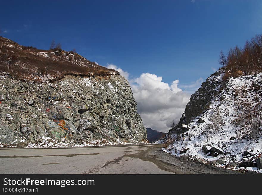 Road, mountains and skies.