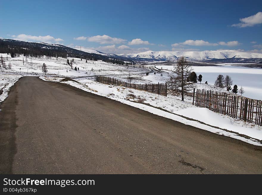 Road, Snow And Skies.