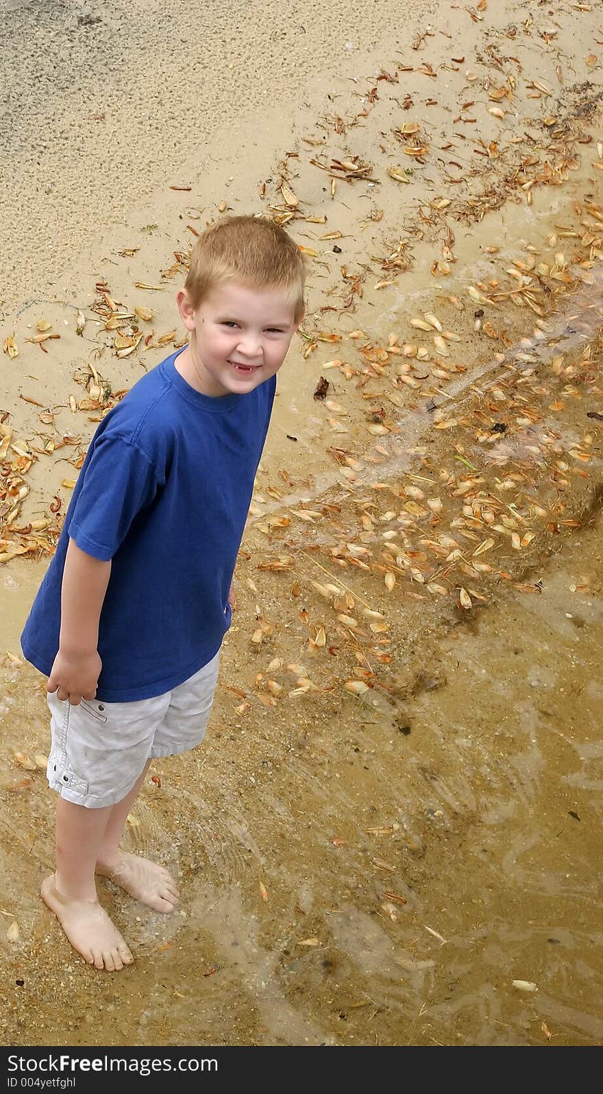 A child wading in a lake. A child wading in a lake.