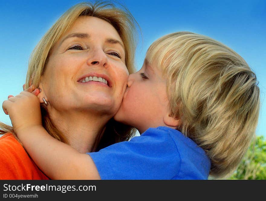 Young boy and his mother share a joyful moment. Young boy and his mother share a joyful moment.