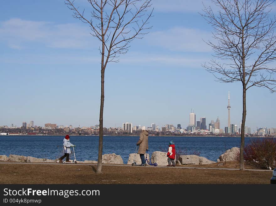 Mother with children and panorama Toronto