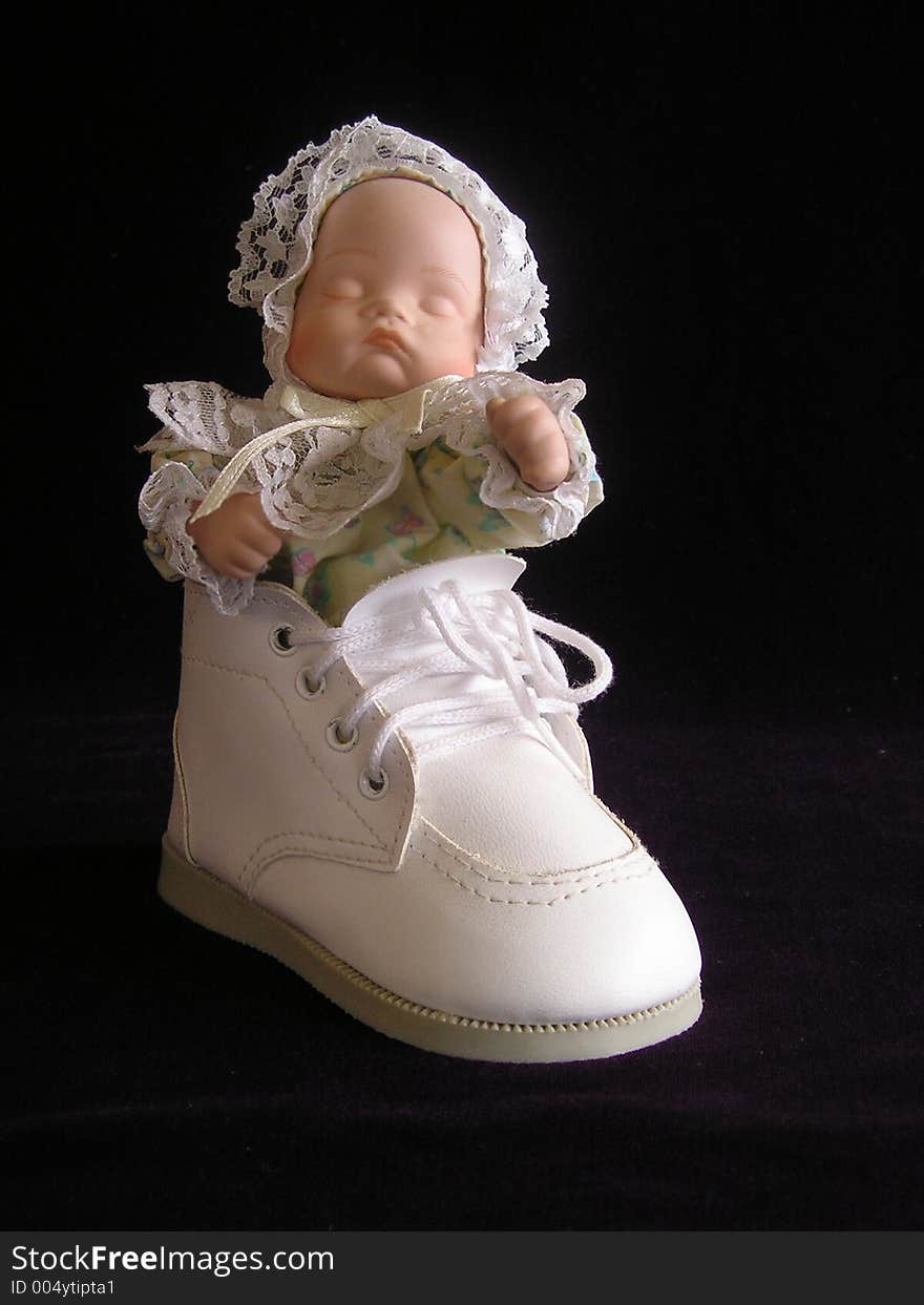 Sleeping doll in baby bootee. Sleeping doll in baby bootee