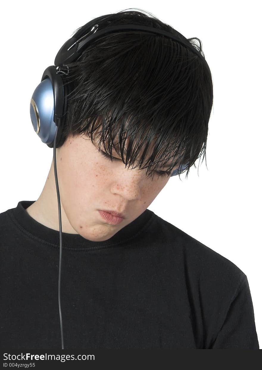 Isolated teen with expression listening to music. Isolated teen with expression listening to music