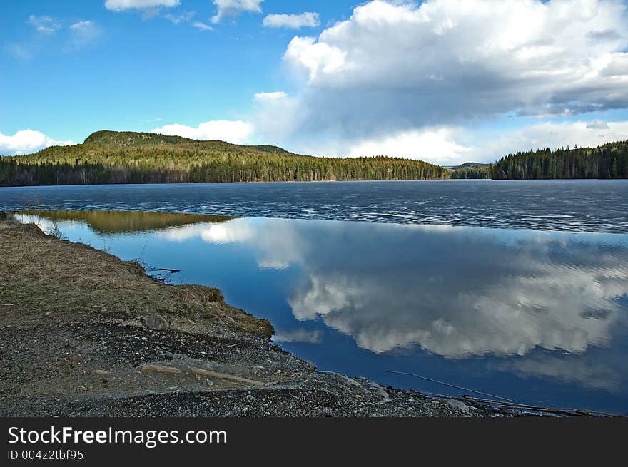 Beautiful lake in rural area BC. Reflection in water.