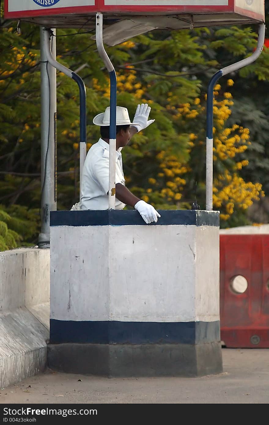 Indian policeman stopping cars