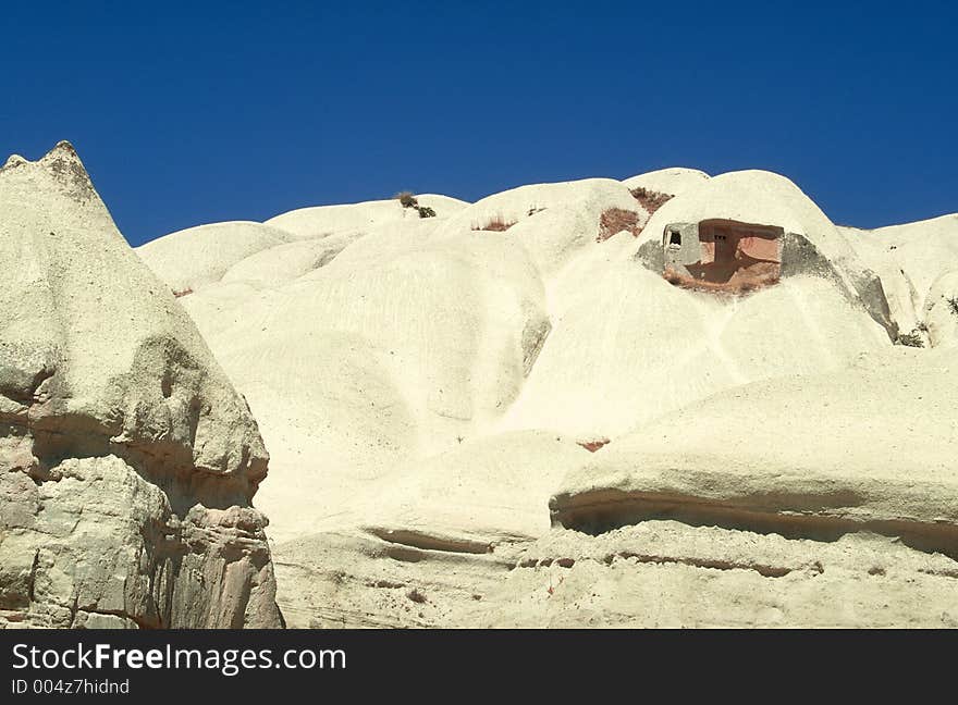 An ancient troglodyte home in a tuff hill, Cappadocia, Turkey. An ancient troglodyte home in a tuff hill, Cappadocia, Turkey