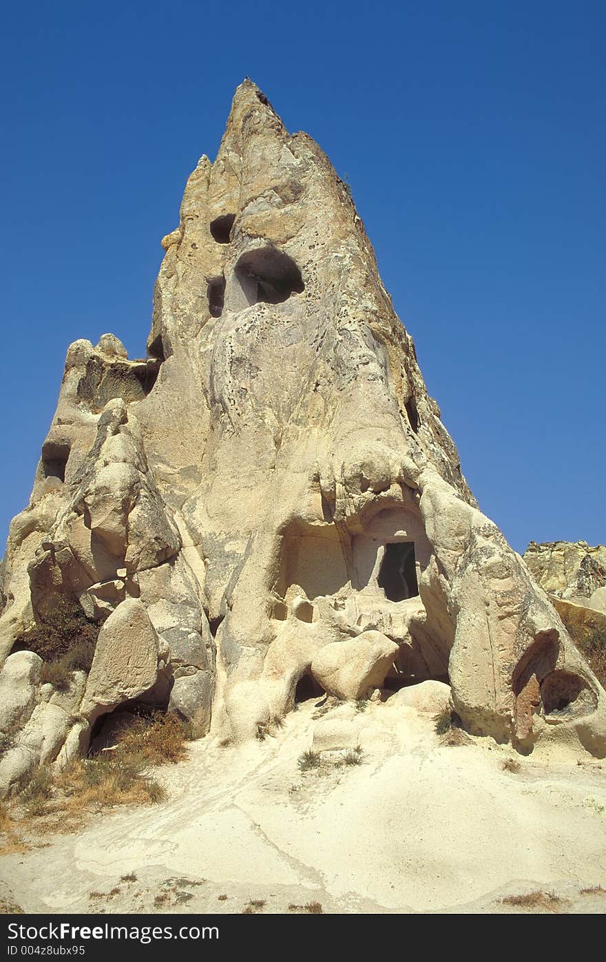 Ancient houses digged in the tuff and destroyed by erosion in Cappadocia, Turkey. Ancient houses digged in the tuff and destroyed by erosion in Cappadocia, Turkey