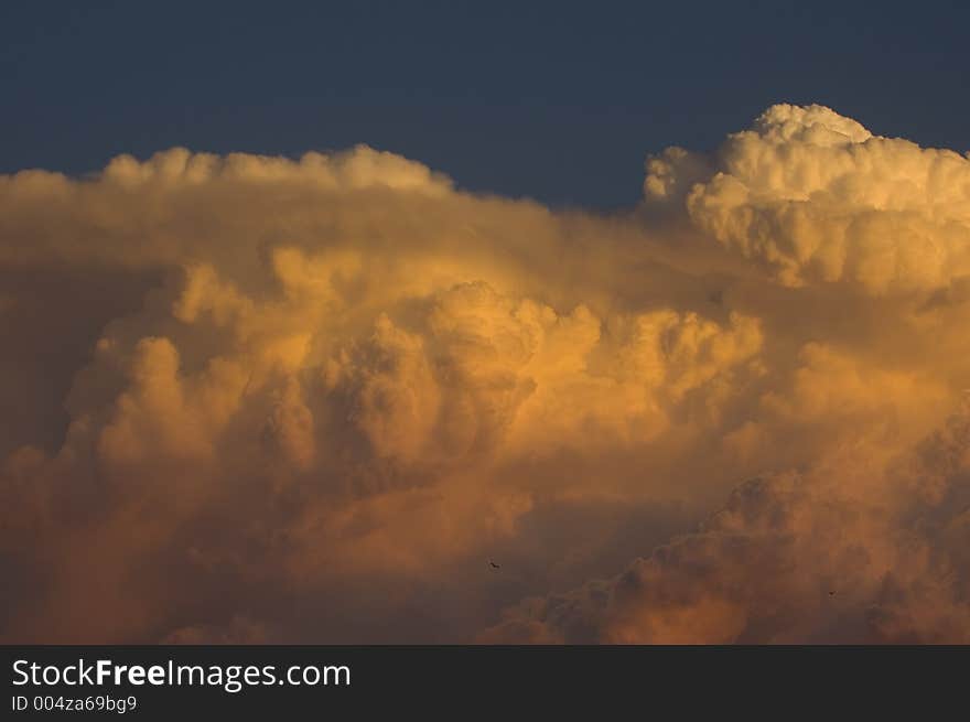 Thunderstorm moving in at sunset