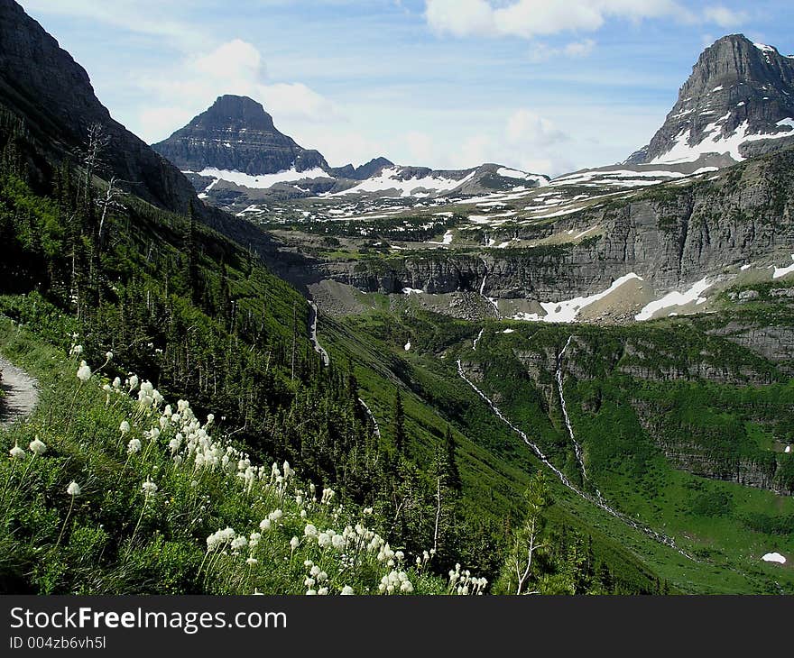 This is a Glacier National Park scene from the Highline Trail during a mid-summer hike. This is a Glacier National Park scene from the Highline Trail during a mid-summer hike.