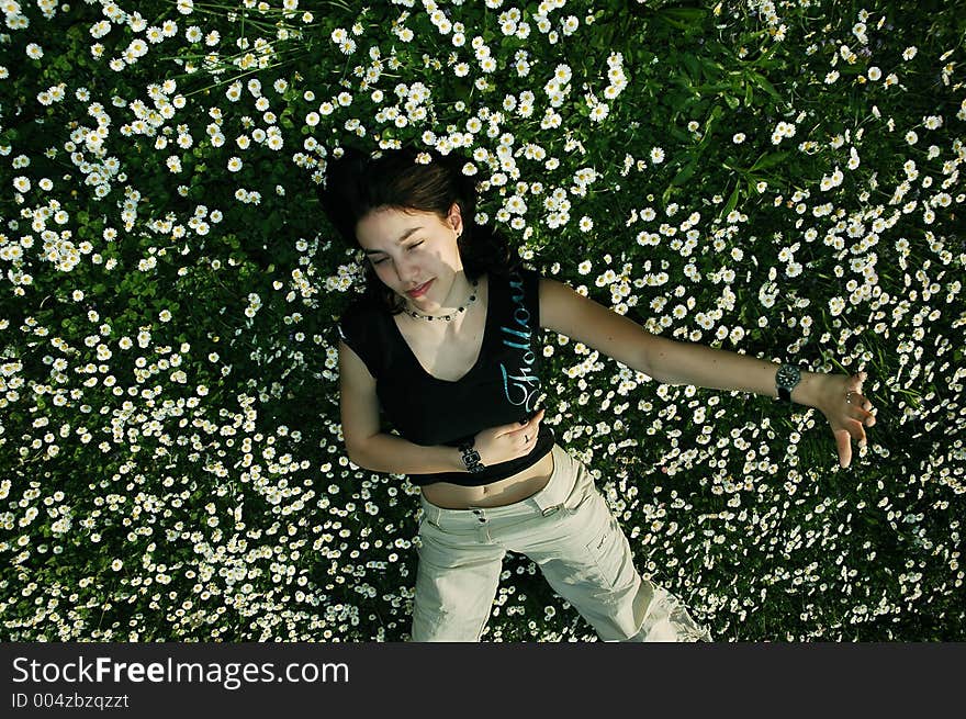 Girl in the flowers defending herself. Girl in the flowers defending herself