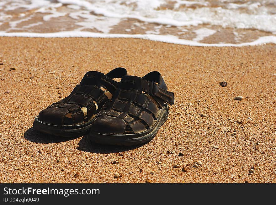 Sandals on the beach. Sandals on the beach