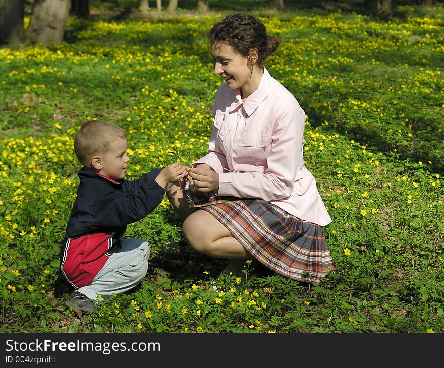 Mother with son in flower meadow